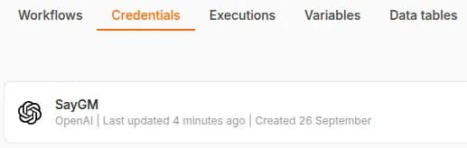 n8n's Credentials tab listing the SayGM credential, an OpenAI credential, ready to pick in the chat model.